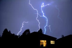 Lighting in a storm coming down on a roof