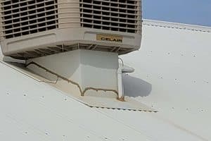 Roof flashings around an air conditioning unit
