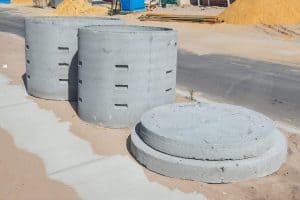 Two concrete soakwells with lids ready for installation