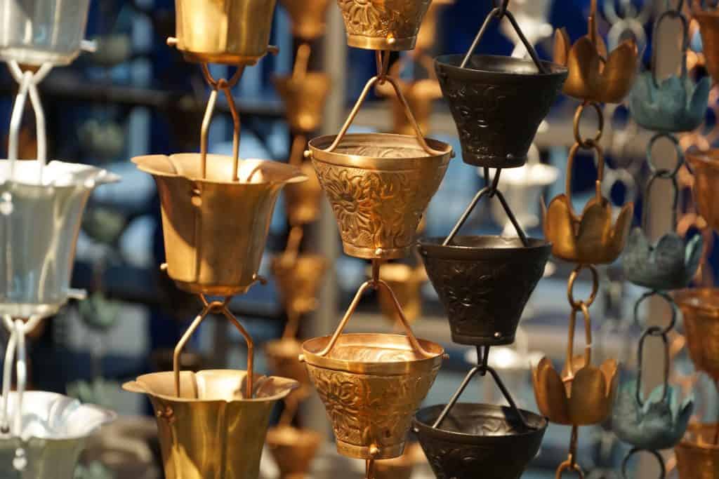 Decorative rain chains in copper and other metals