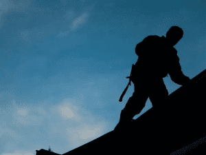 Shadow of man walking on roof