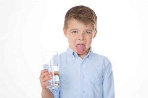 Boy with bad tasting water